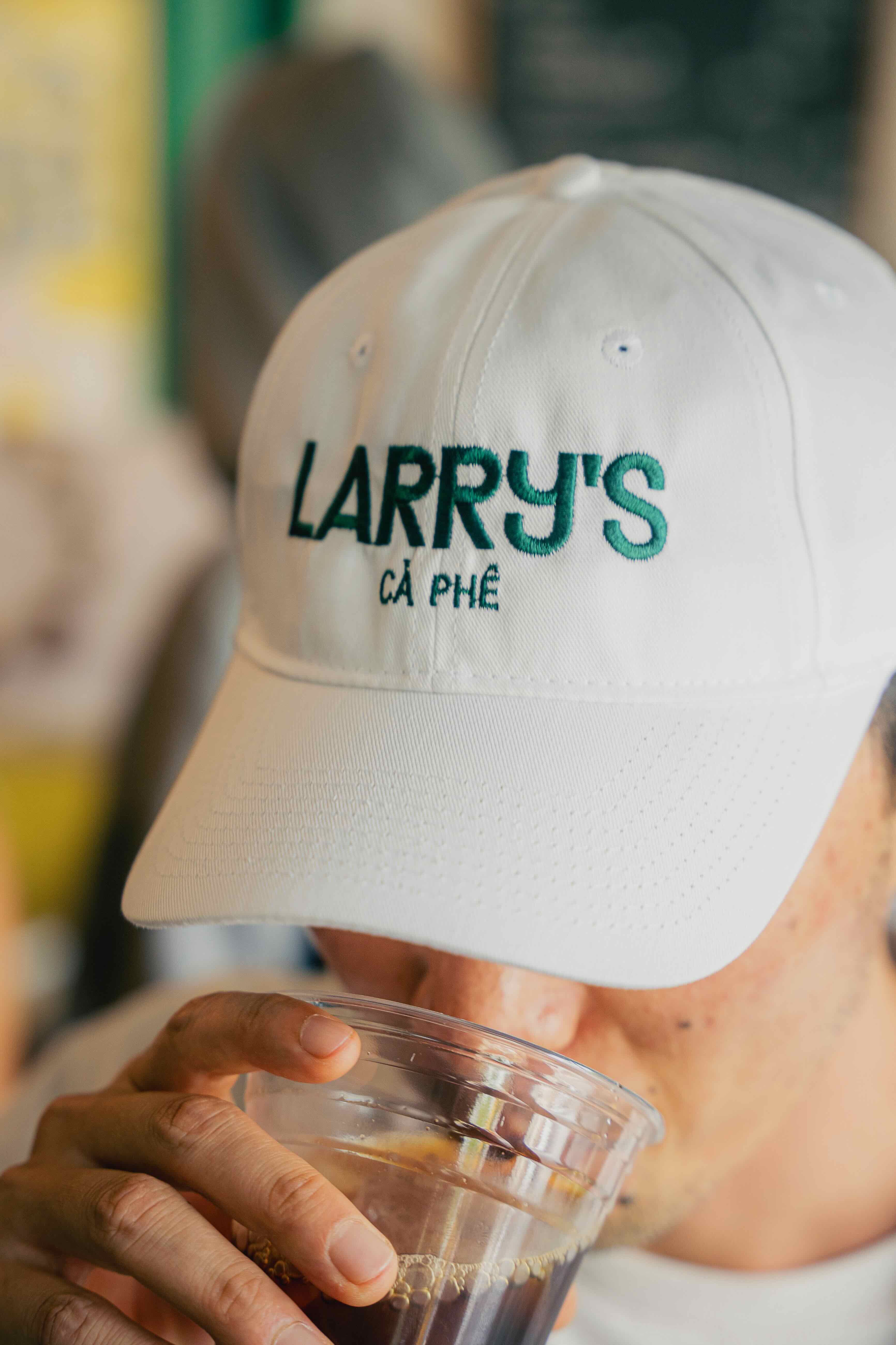 Larrys merch white & yellow hat front photo alt